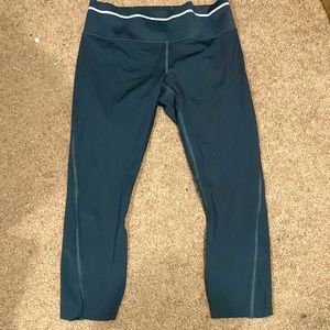 Athleta size medium mid calf leggings a smoke grey color